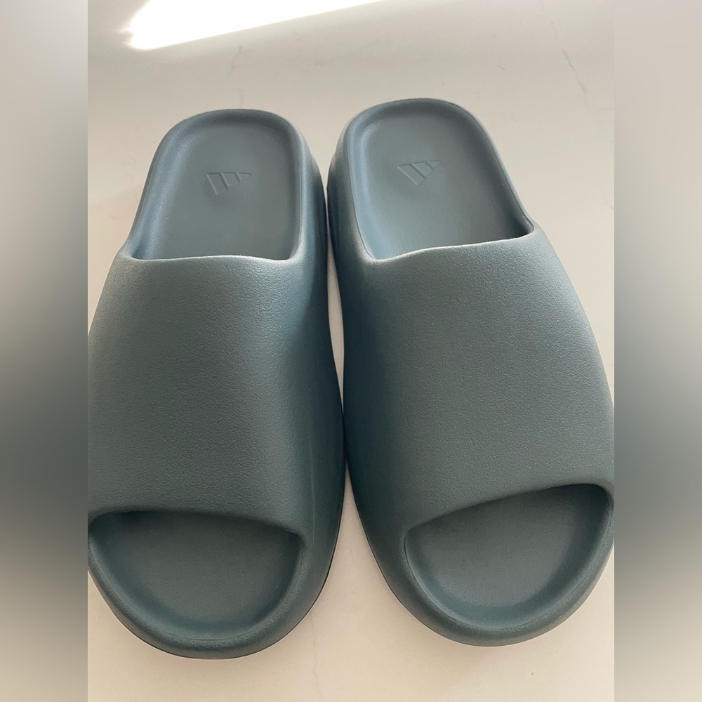 Yeezy slides by Adidas 
Size 9. Brand new